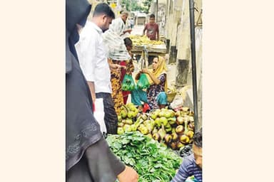 Low-income people earn a living with raw palm kernels in Chandpur