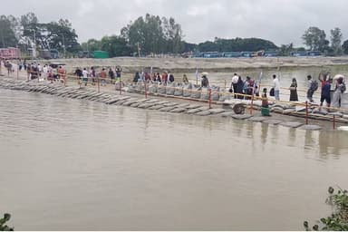 Rising Padma water floods Paturia Launch Ghat access road